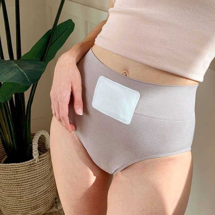 a person with one of the heating patches on the front of their underwear