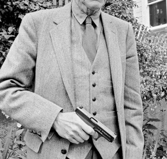 William S Burroughs looks straight at the camera