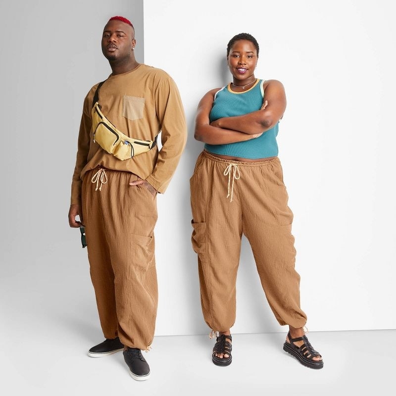 Male and female model wearing brown gauze cargo pants