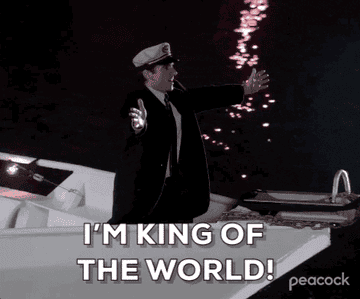 GIF of Michael on a boat saying &quot;I&#x27;m King of the World!&quot;