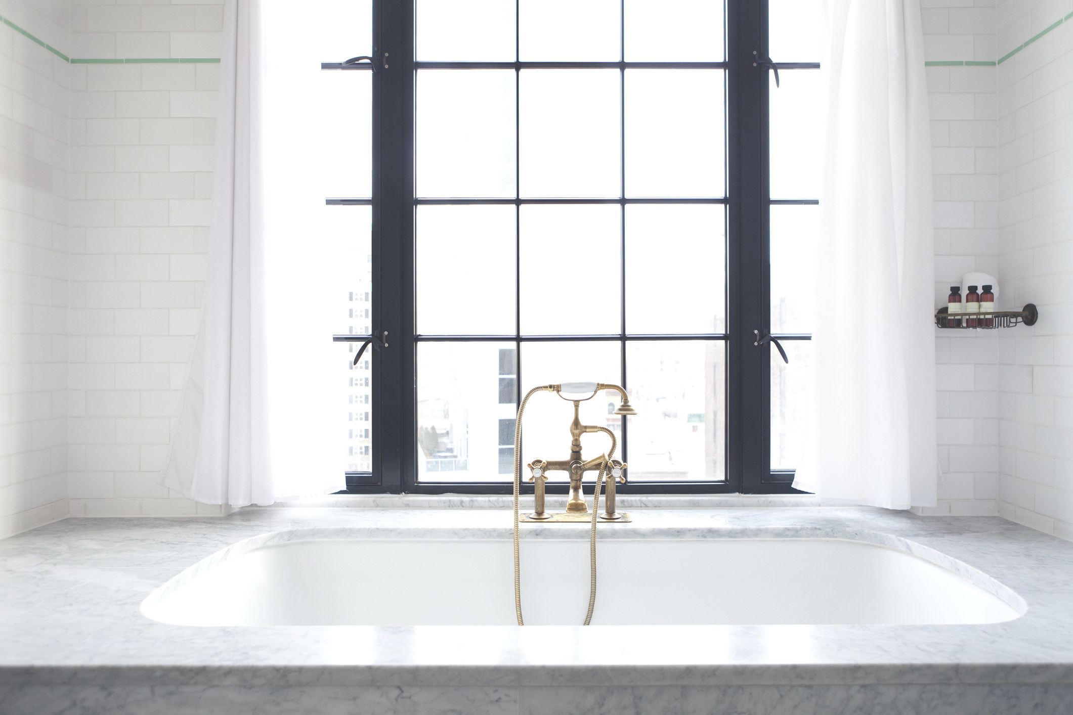 A bathtub near a window