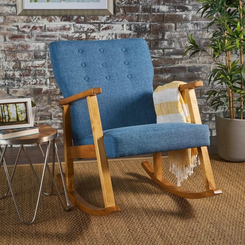 Blue rocking chair with wooden body