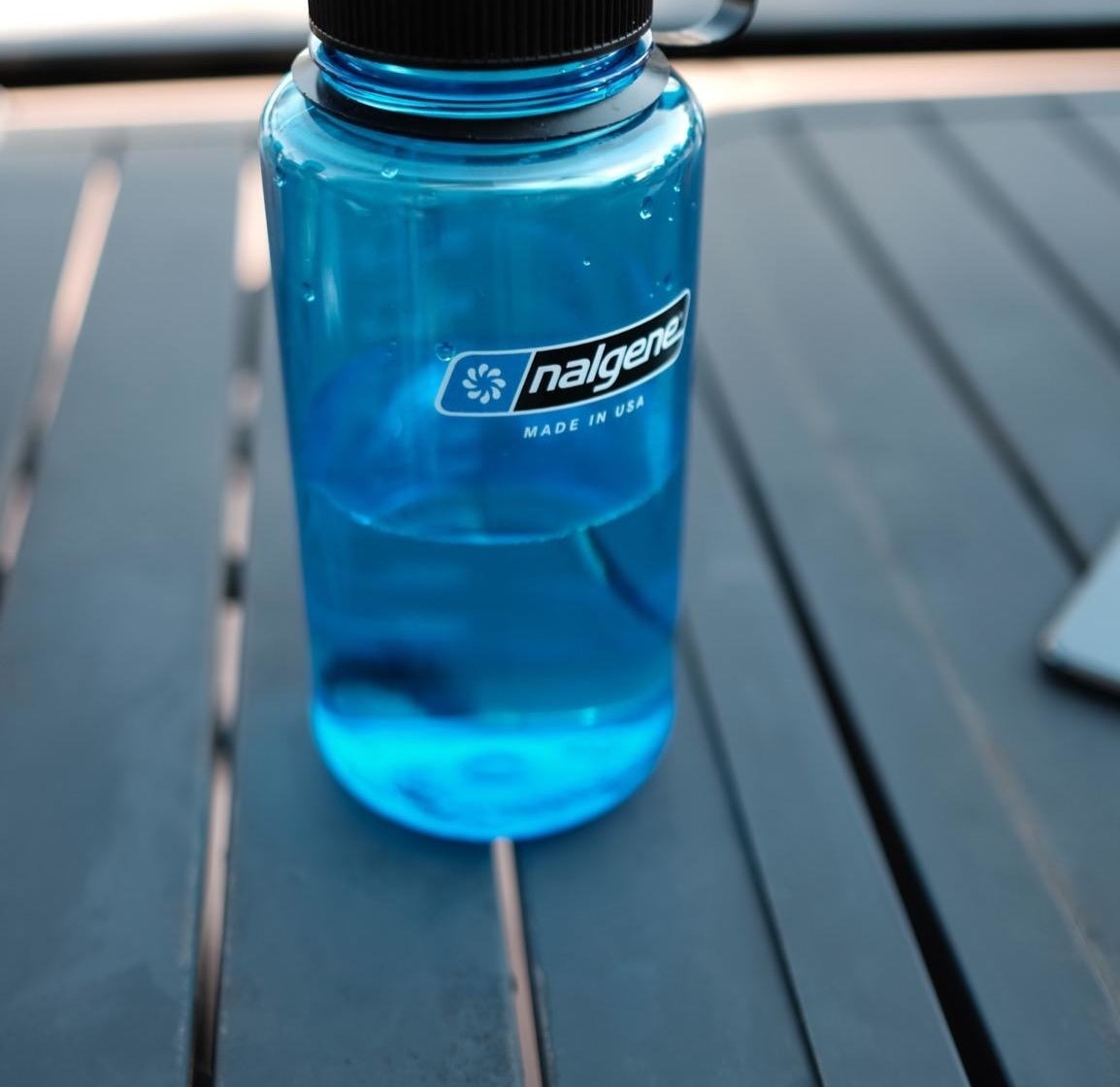 a reviewer&#x27;s photo of the water bottle in blue