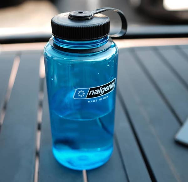 a reviewer's photo of the water bottle in blue
