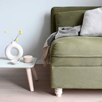 a sofa with a curved leg