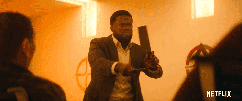 a gif of Kevin Hart swinging knives together and then accidentally cutting someones face
