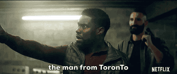 A gif of Kevin Hart talking to a man tied up with text that says &quot;the man from Toronto&quot;