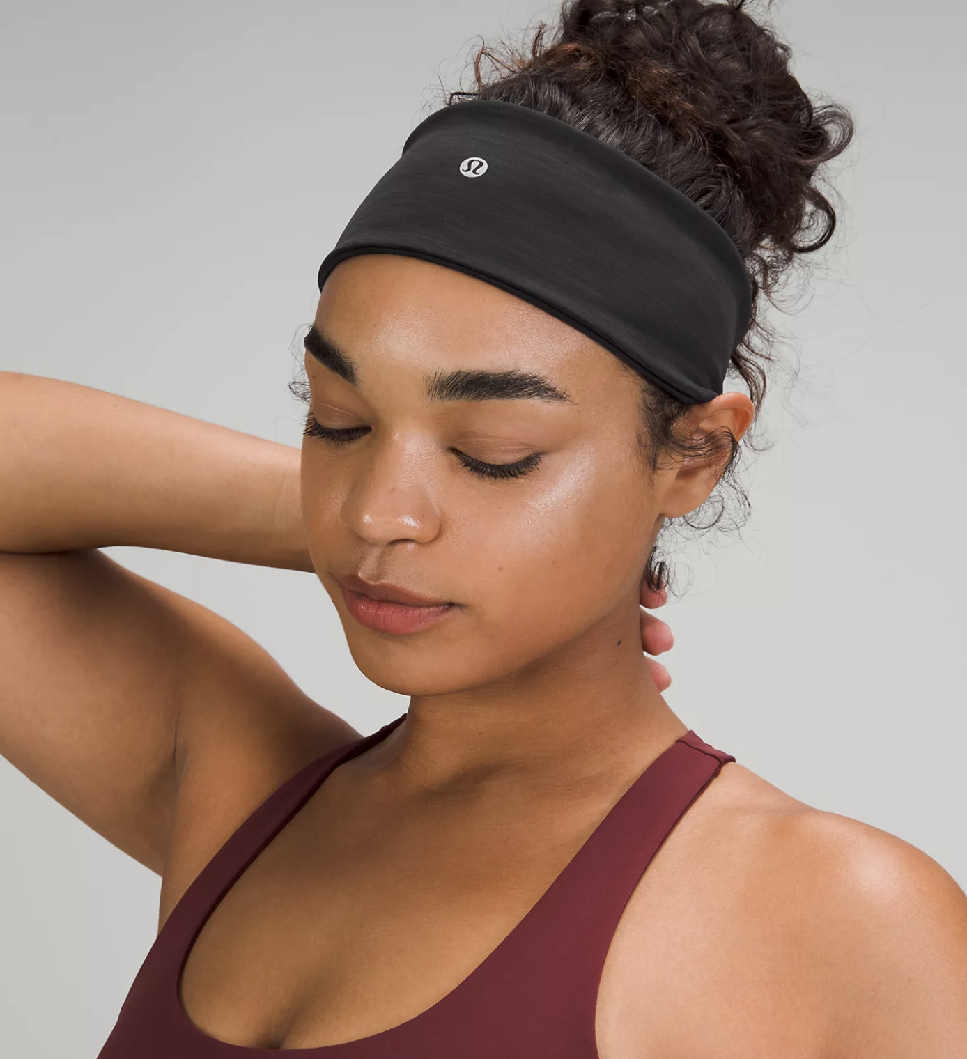A person wearing a sports bra and a headband