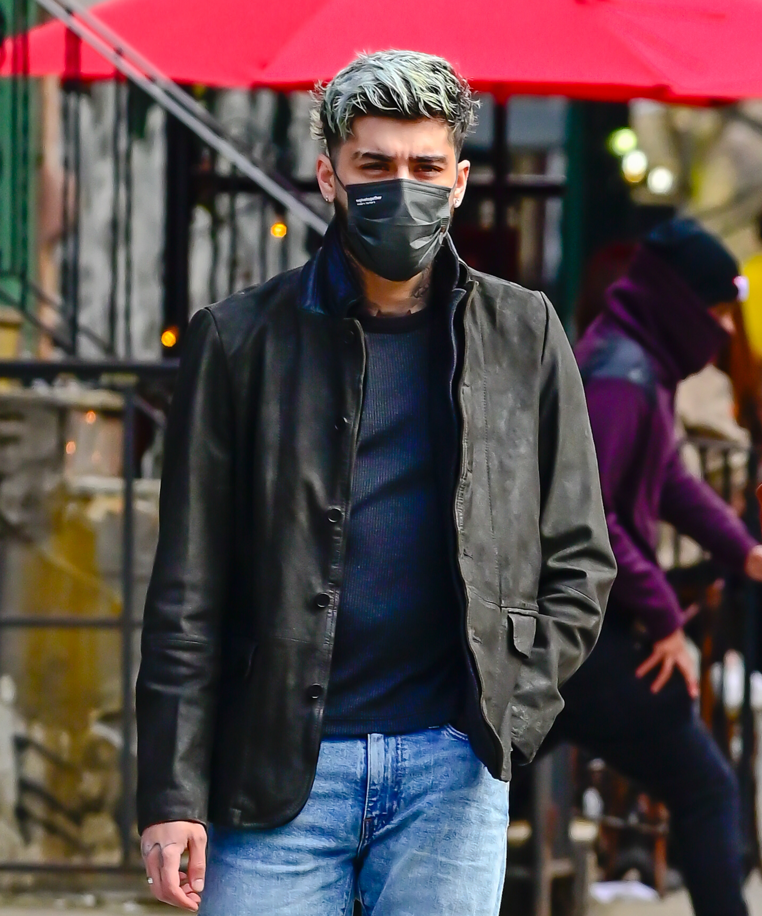 Zayn walking with a mask on