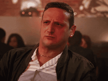 Gif of Tim Robinson looking at something and saying, &quot;what the heck&quot;