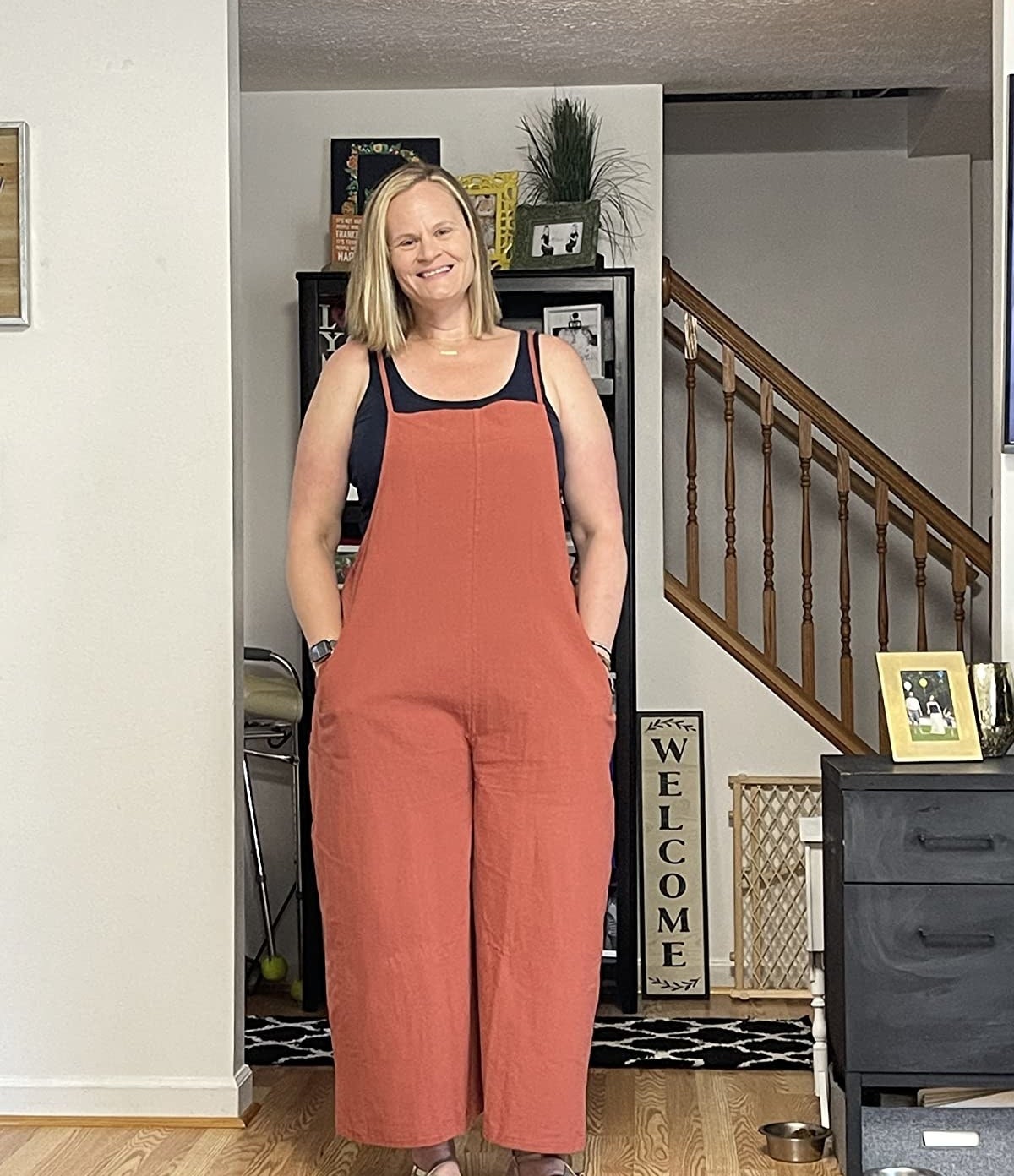 Reviewer wearing the red jumpsuit over tank