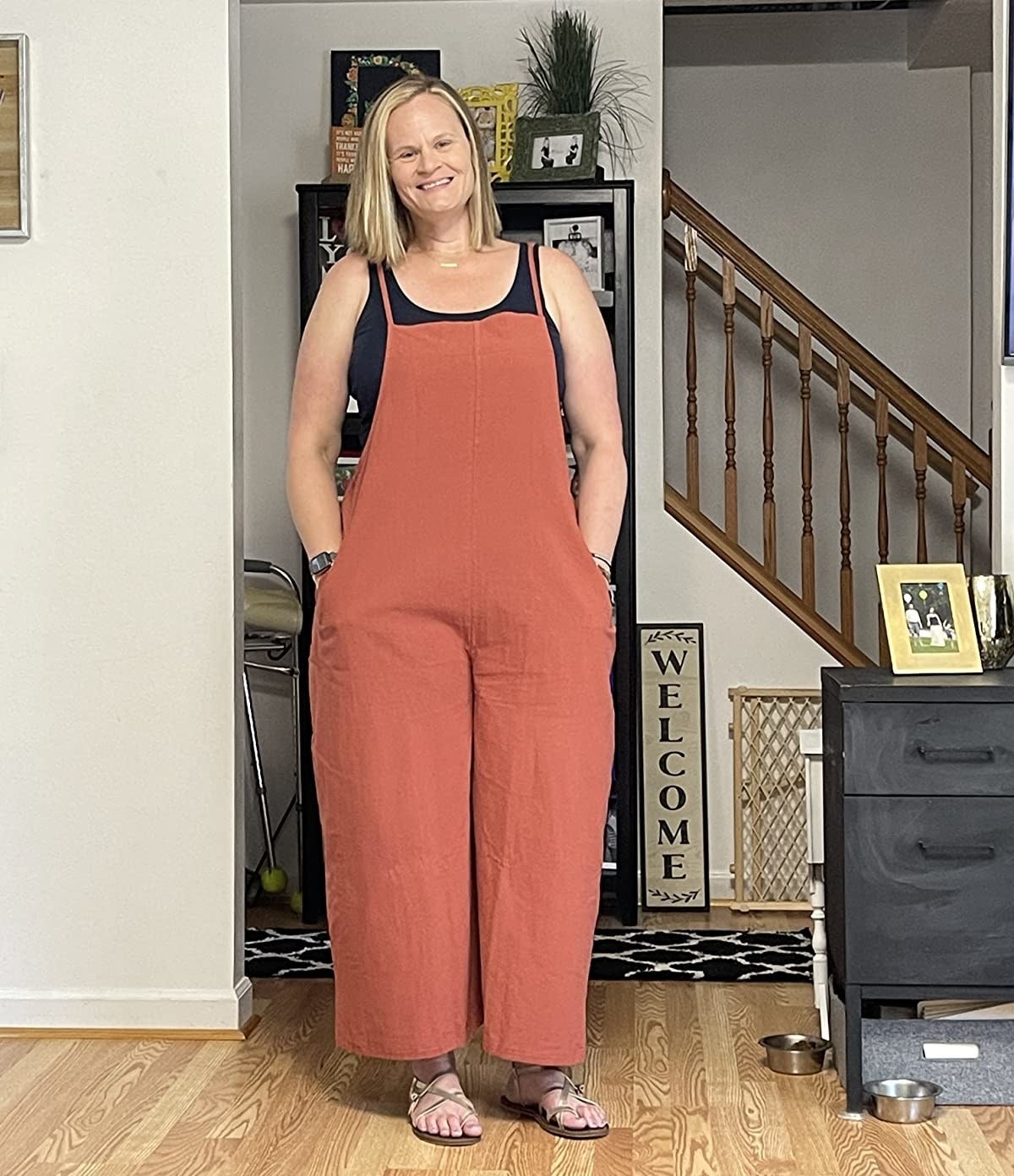 Reviewer wearing the red jumpsuit over tank