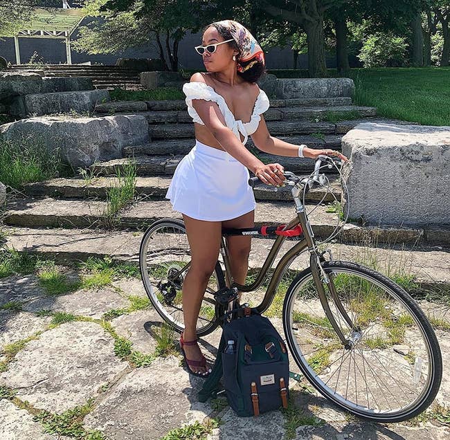 Reviewer wearing the white tennis skirt while riding their bike