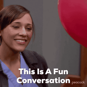 woman forcing a smile saying this is a fun conversation