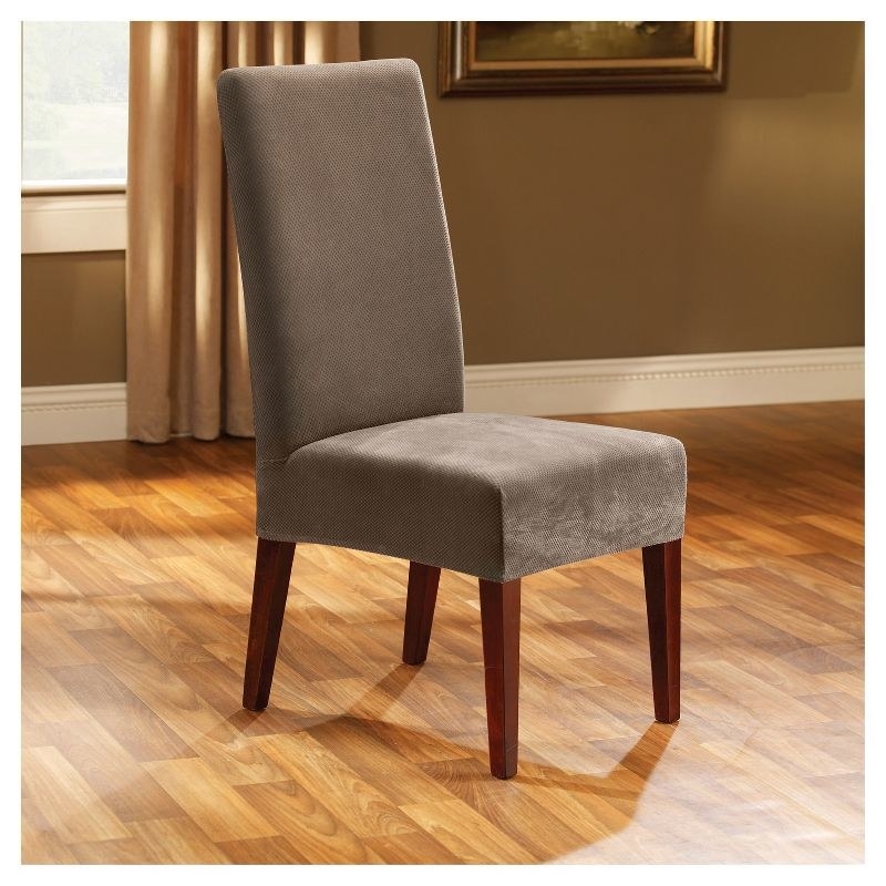 Taupe colored slip cover on dining room chair