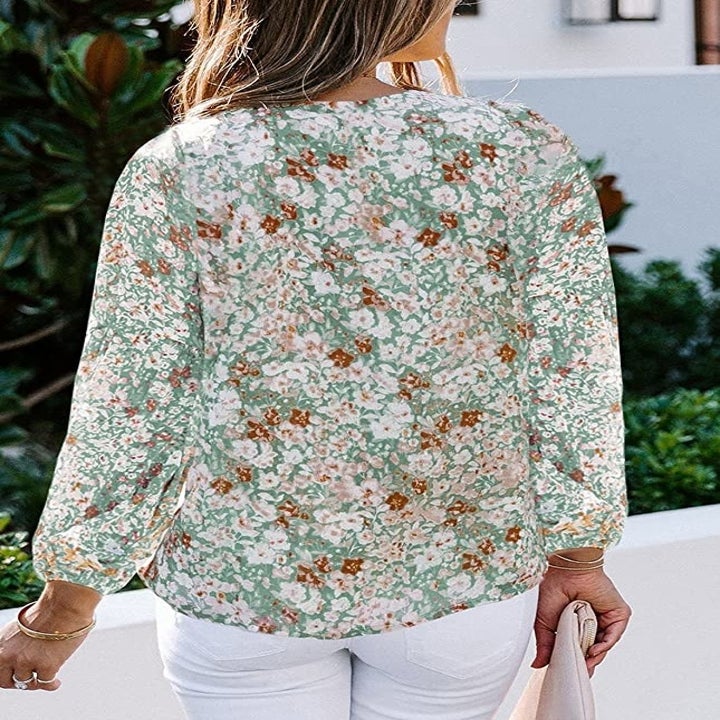 model wearing the floral print blouse in green