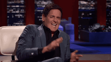 A man clapping and laughing