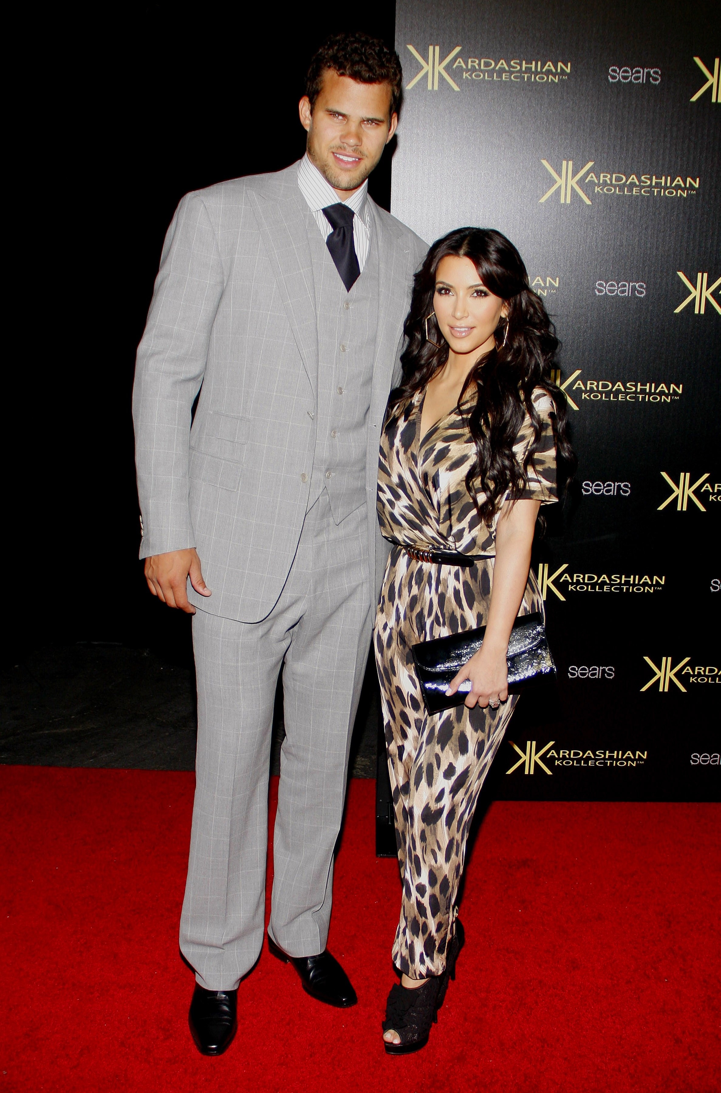Kris Humphries and Kim Kardashian posing at an event