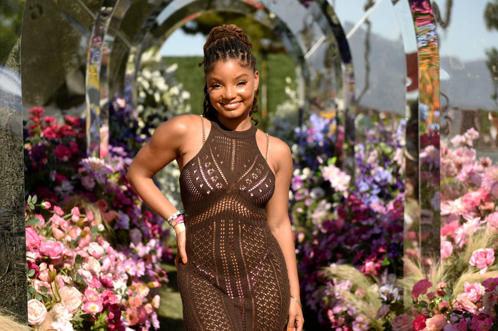 Halle in a halter dress amid flowers