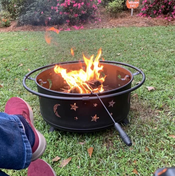 reviewer image of a star and moon steel wood burning outdoor firepit
