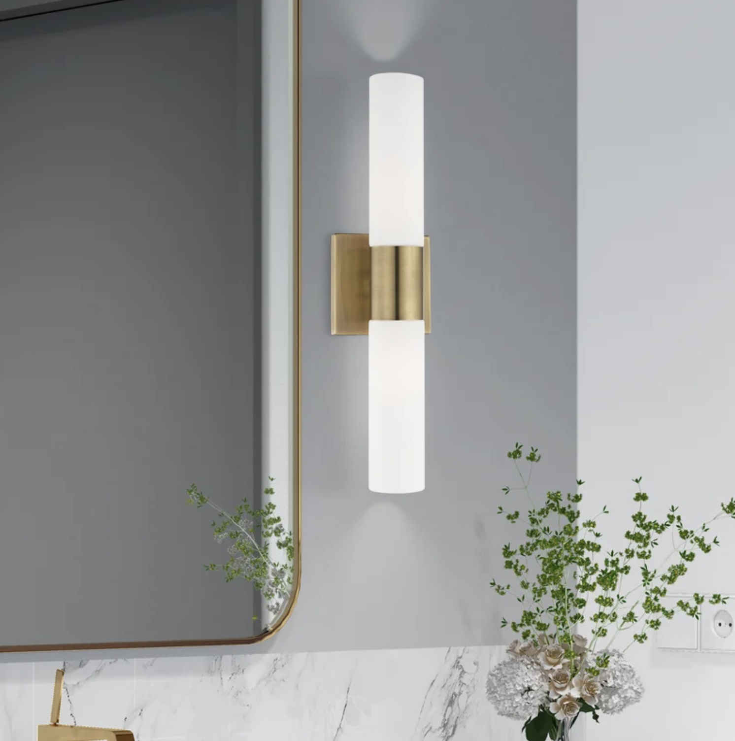 An image of a dimmable light bath bar next to a mirror