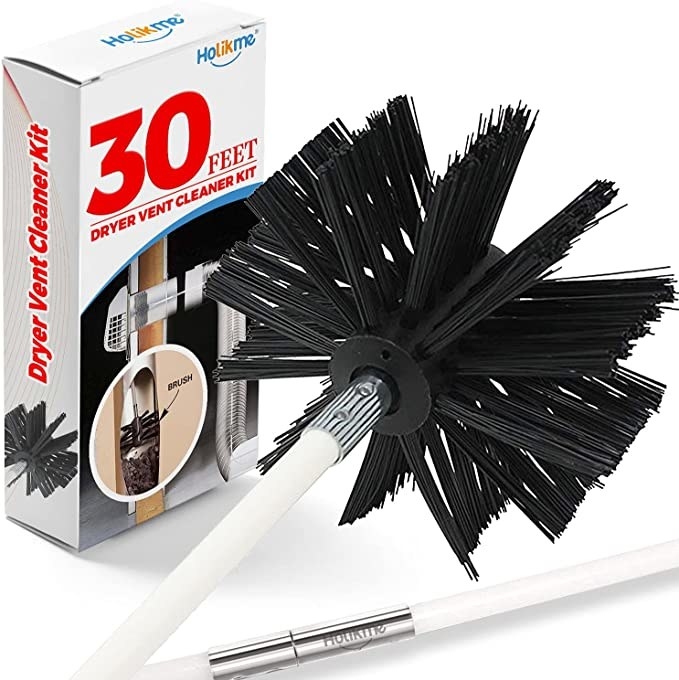 the brush in front of the box on a plain background