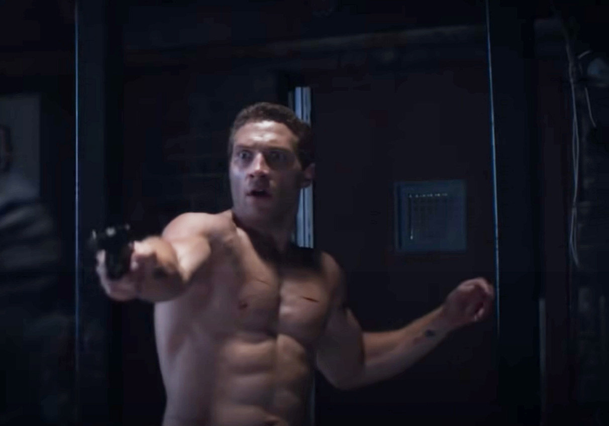 A shirtless Jai holding a gun in Terminator Genesis