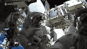 an astronaut waving