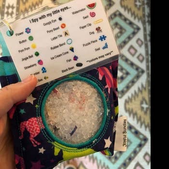 reviewer's photo showing the sensory bag and attached seek and find laminated card