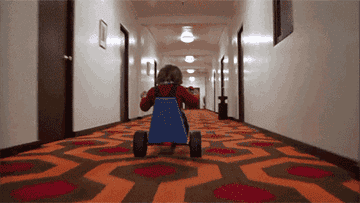 Danny riding his Big Wheel down a hallway in the Overlook Hotel in &quot;The Shining&quot;