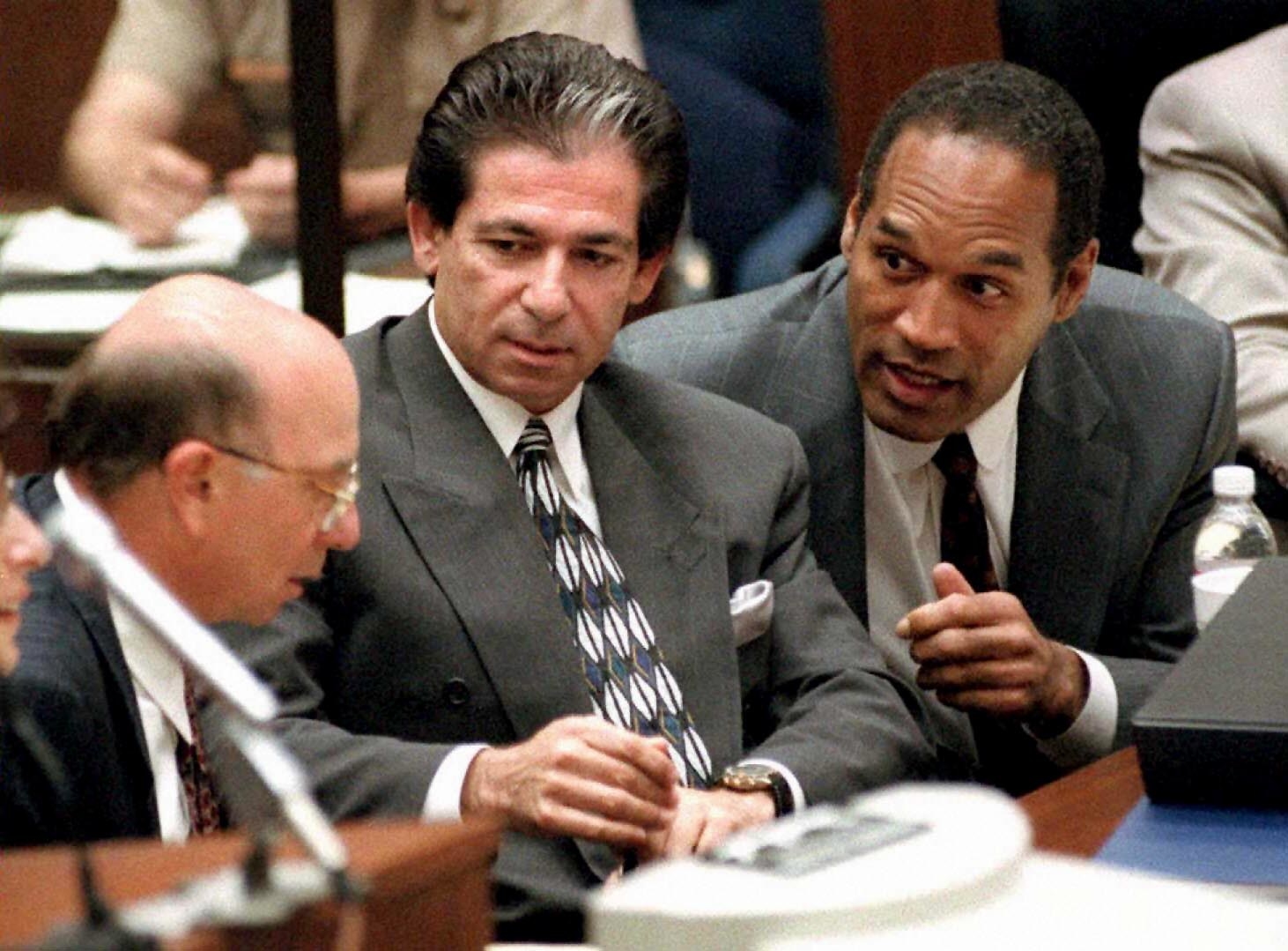 Robert Kardashian and O.J. Simpson in a courtroom