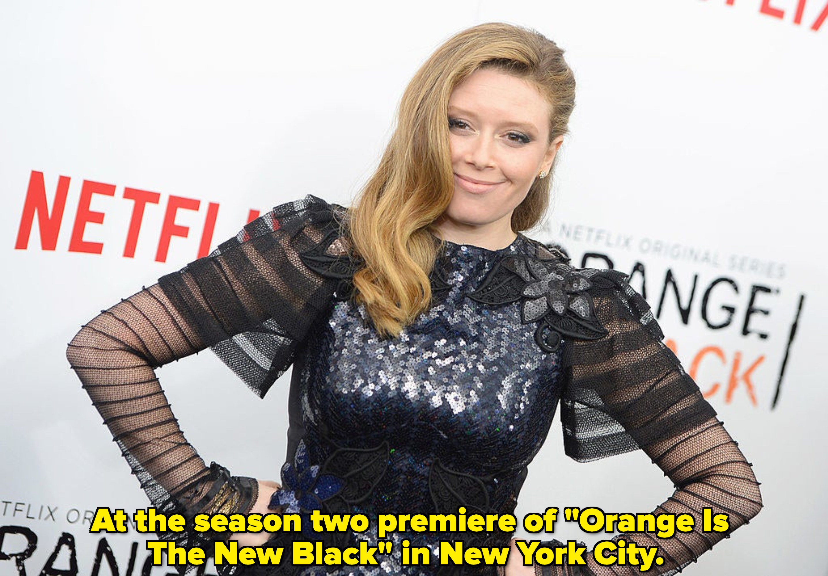 Lyonne smiles and puts her hands on her hips at an &quot;Orange Is the New Black&quot; premiere