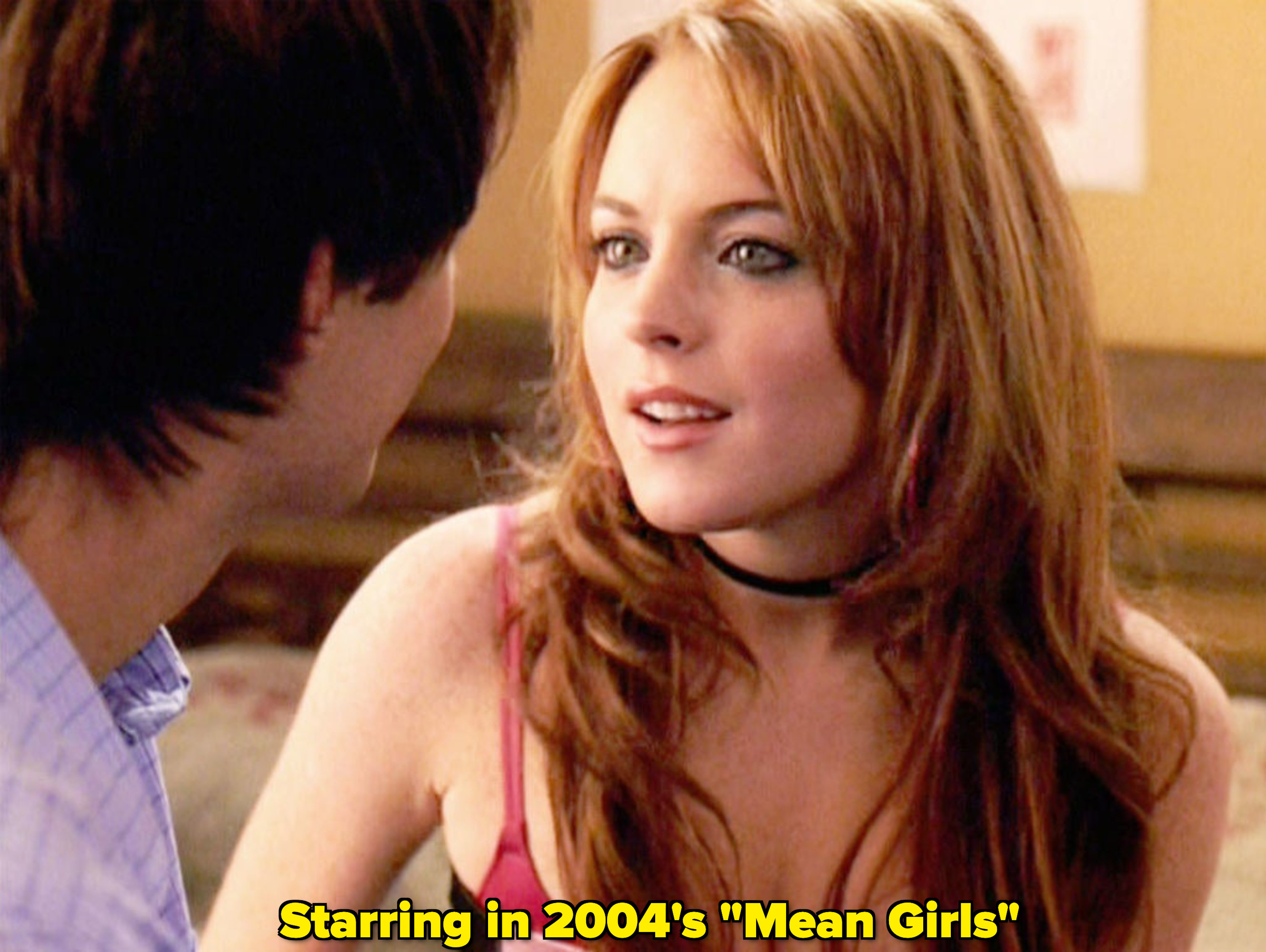 Lindsay Lohan looking at a guy and smiling in &quot;Mean Girls&quot;