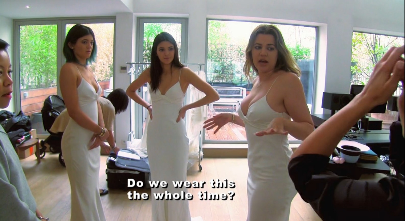 Kylie Jenner, Kendall Jenner, and Khloe Kardashian in white bridesmaid dresses