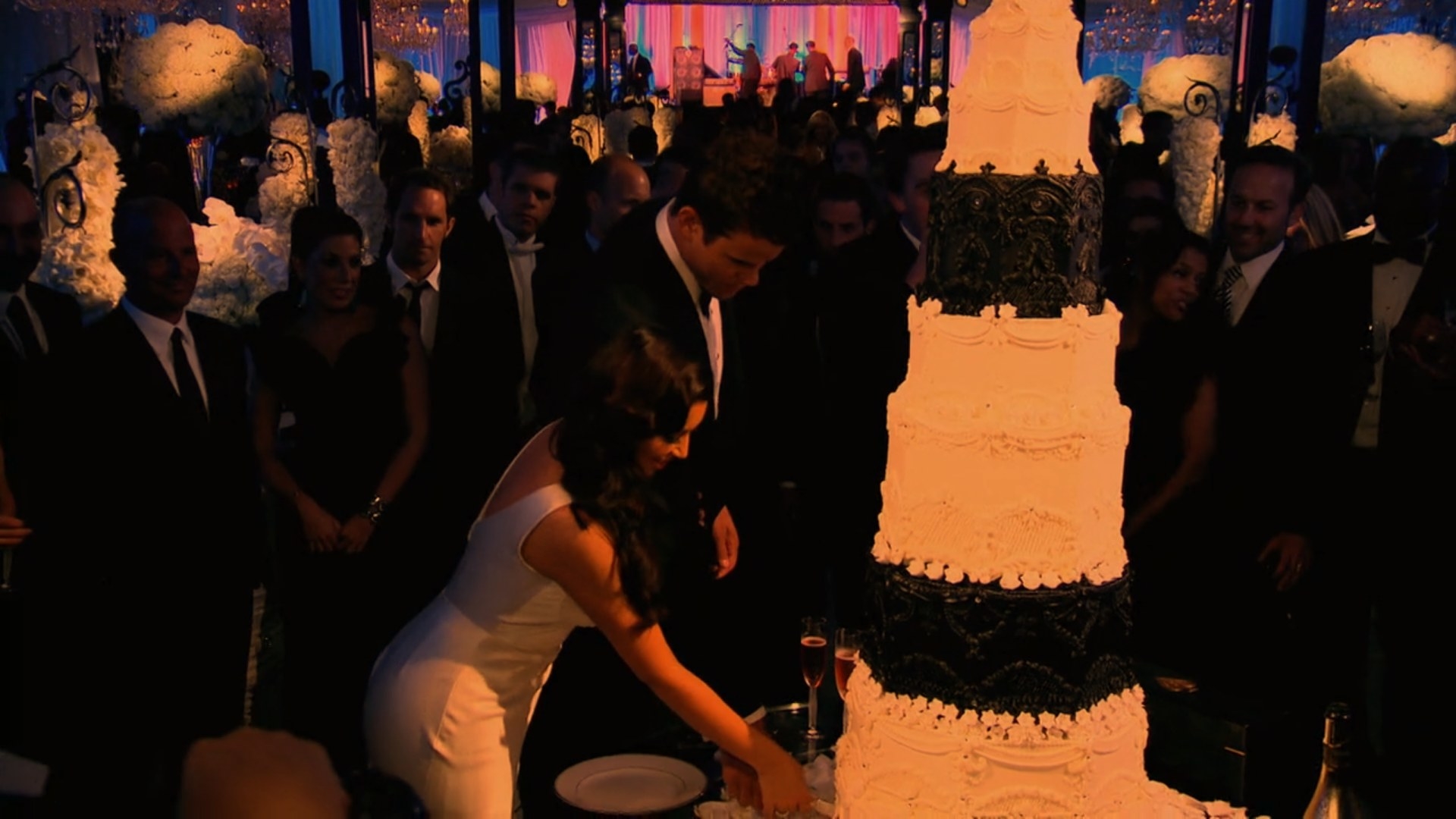 Kim Kardashian and Kris Humphries cutting their wedding cake