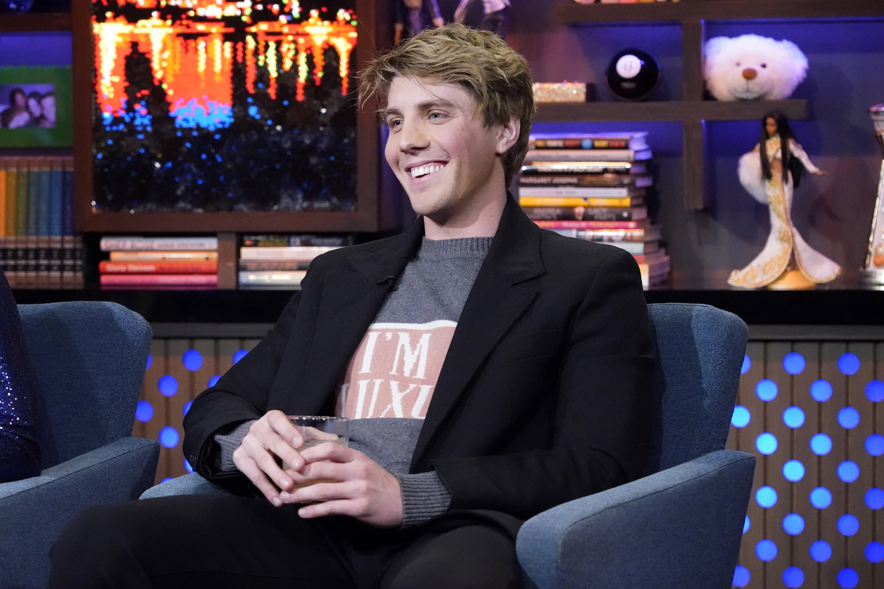 close up of Lukas sitting down during a talk show