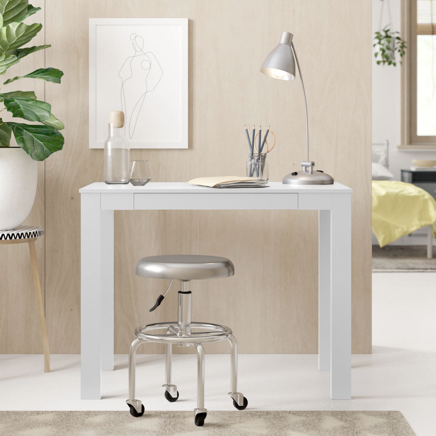 The desk with a rolling stool in front of it