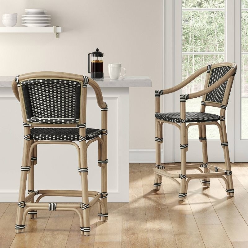 a set of rattan bar stool in black at a coffee nook