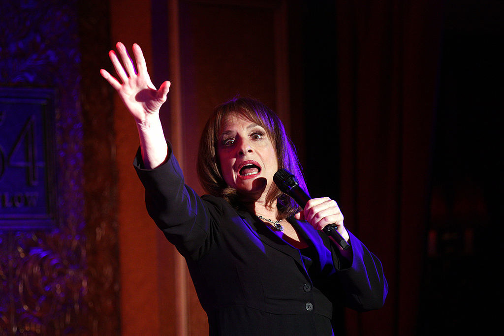 Patti LuPone sings into a microphone