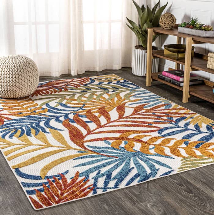 The tropical colored floral rug in living room