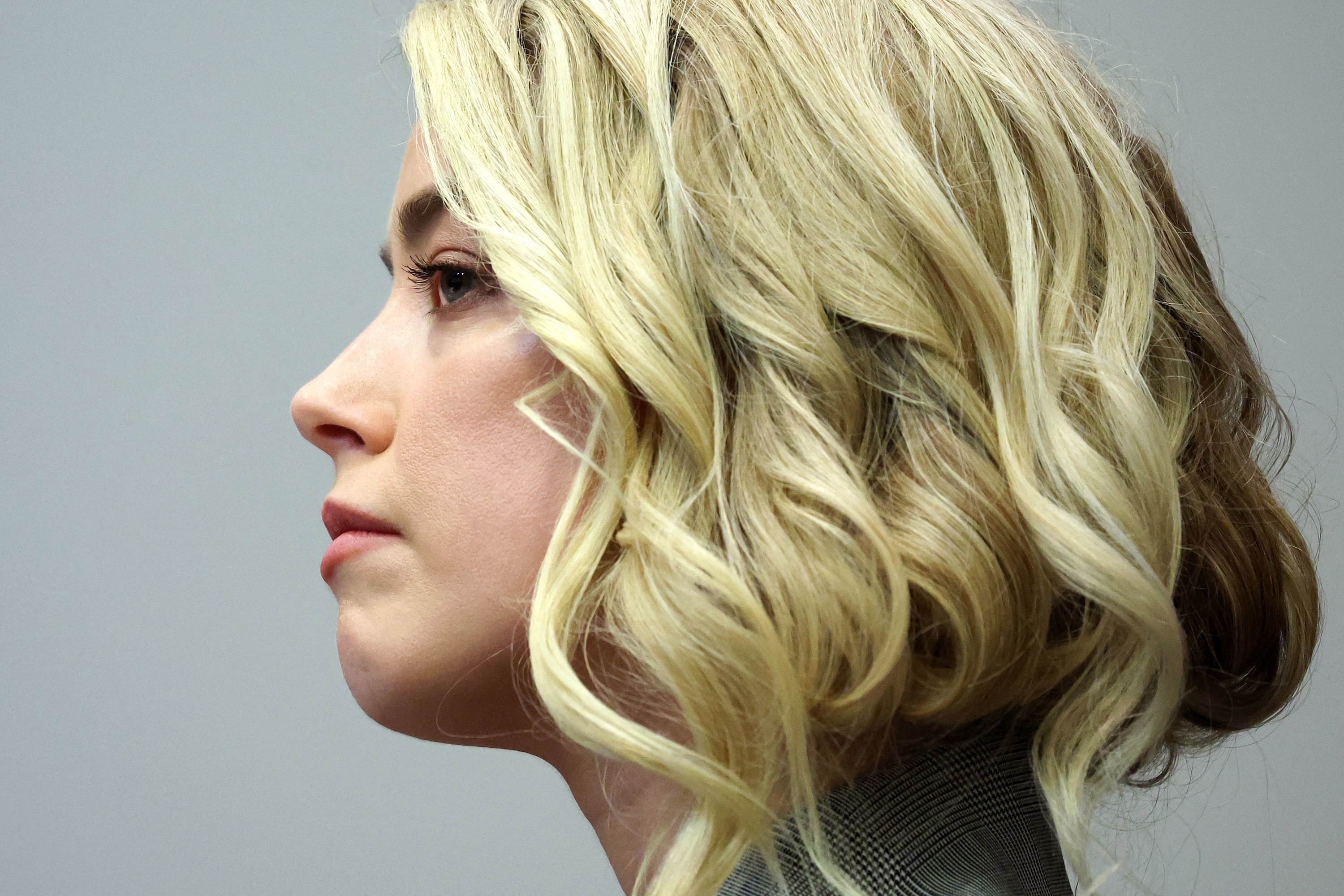 Profile view of Amber in court