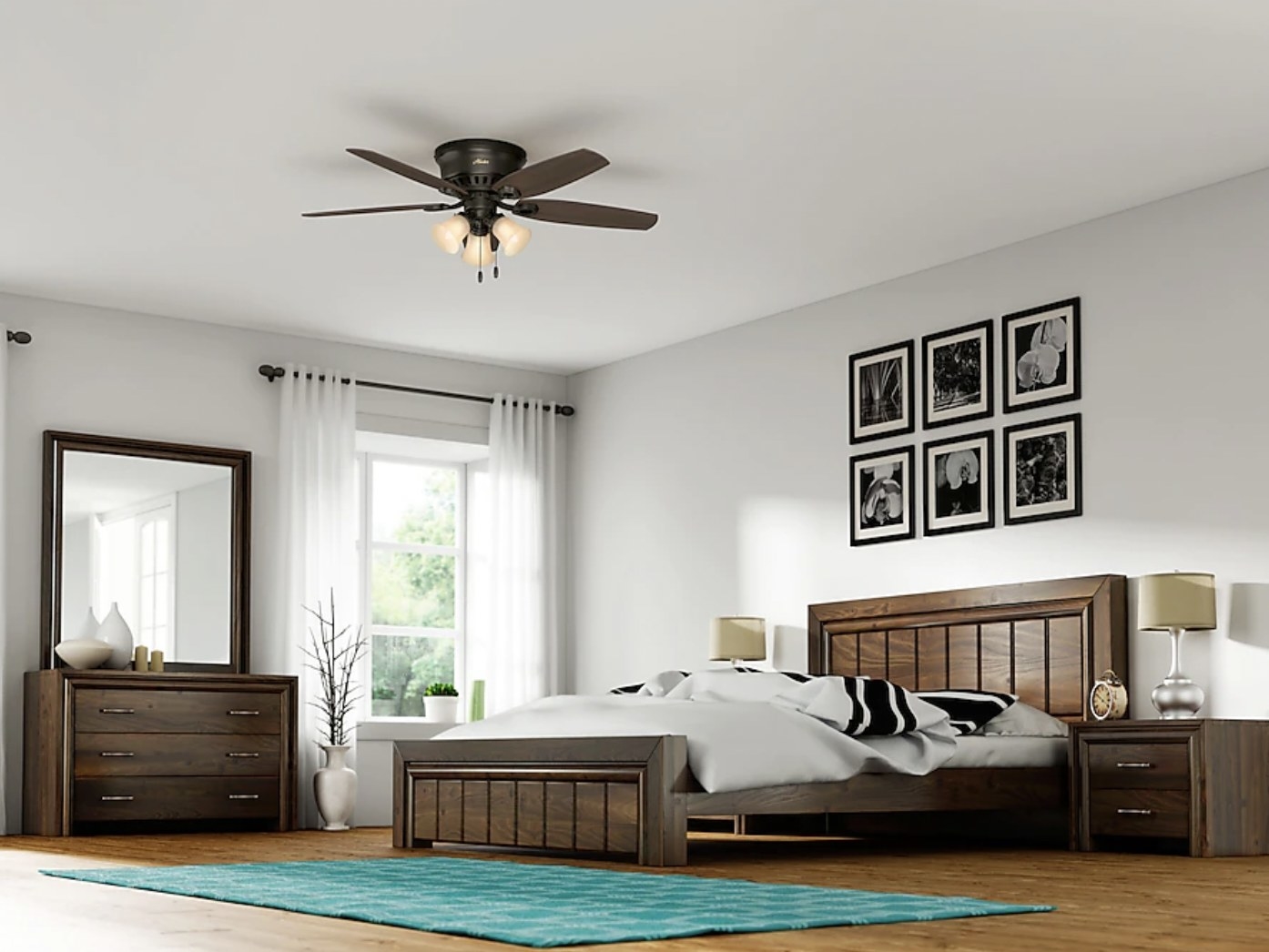the brown five-blade ceiling fan with three lights hanging above bed