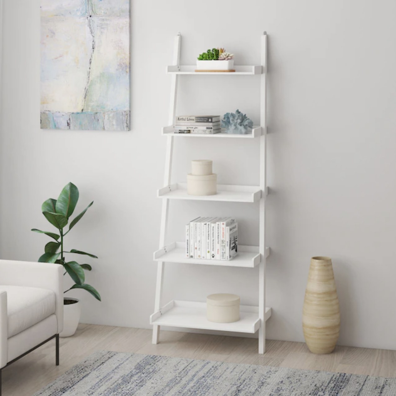 The white five-tier shelf holding various objects