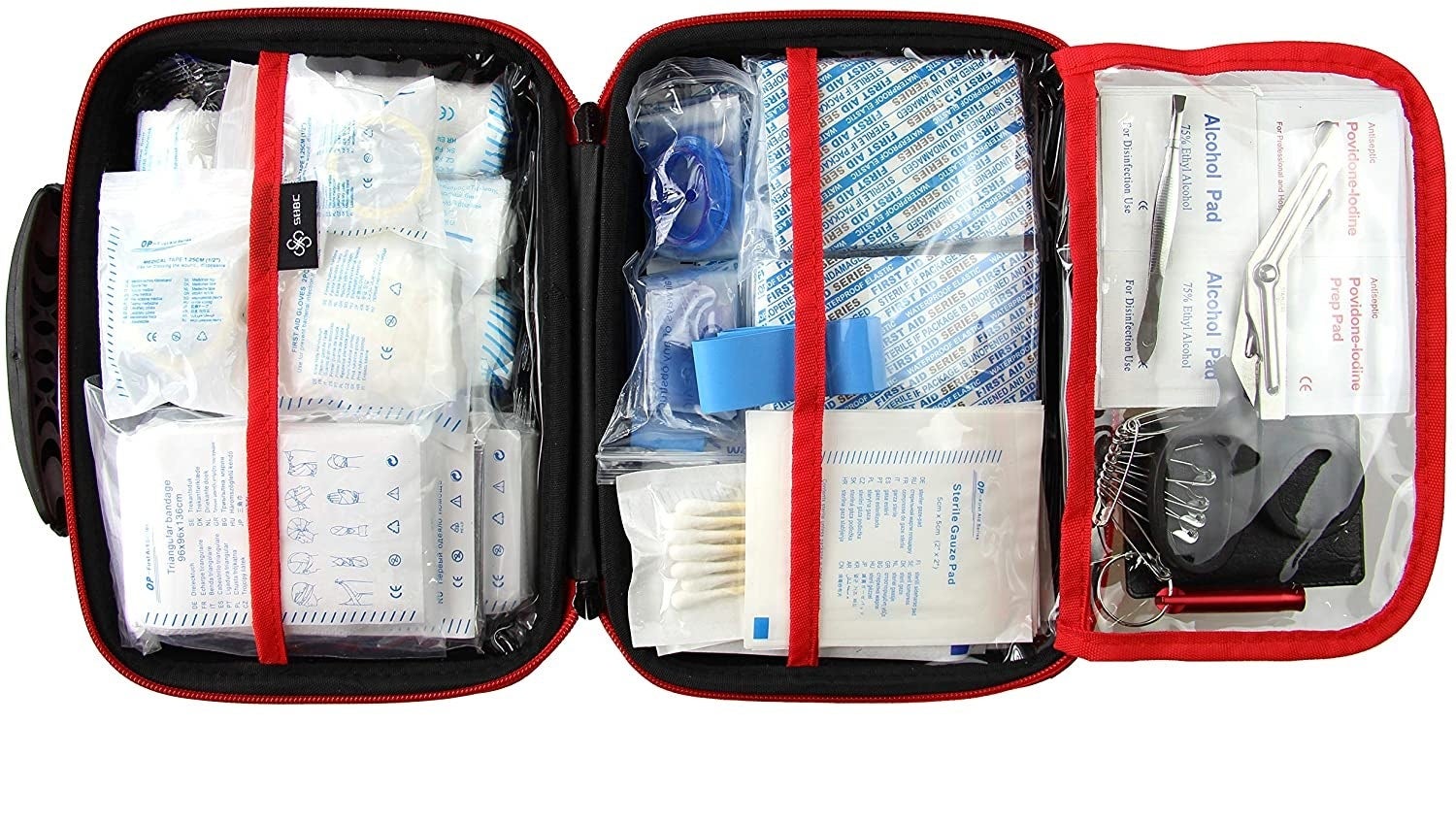 The first aid kit opened showing everything that&#x27;s inside against a plain background