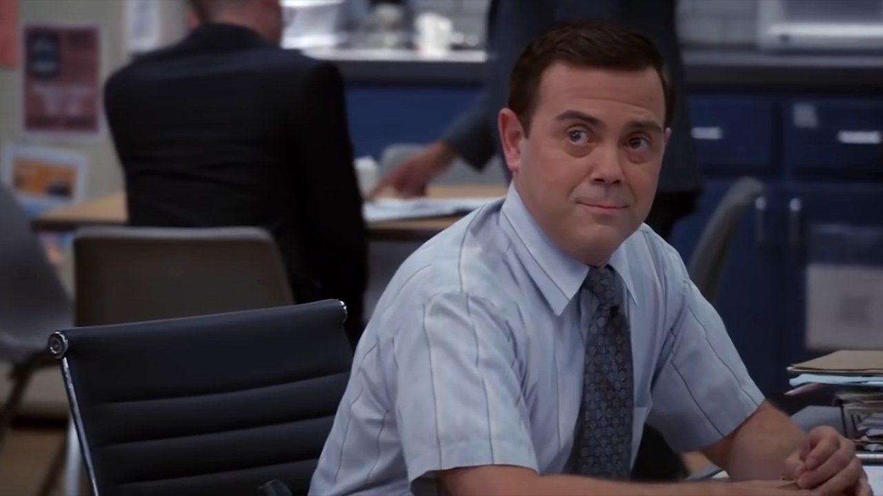 Boyle sitting at his desk smiling in &quot;Brooklyn Nine-Nine&quot;