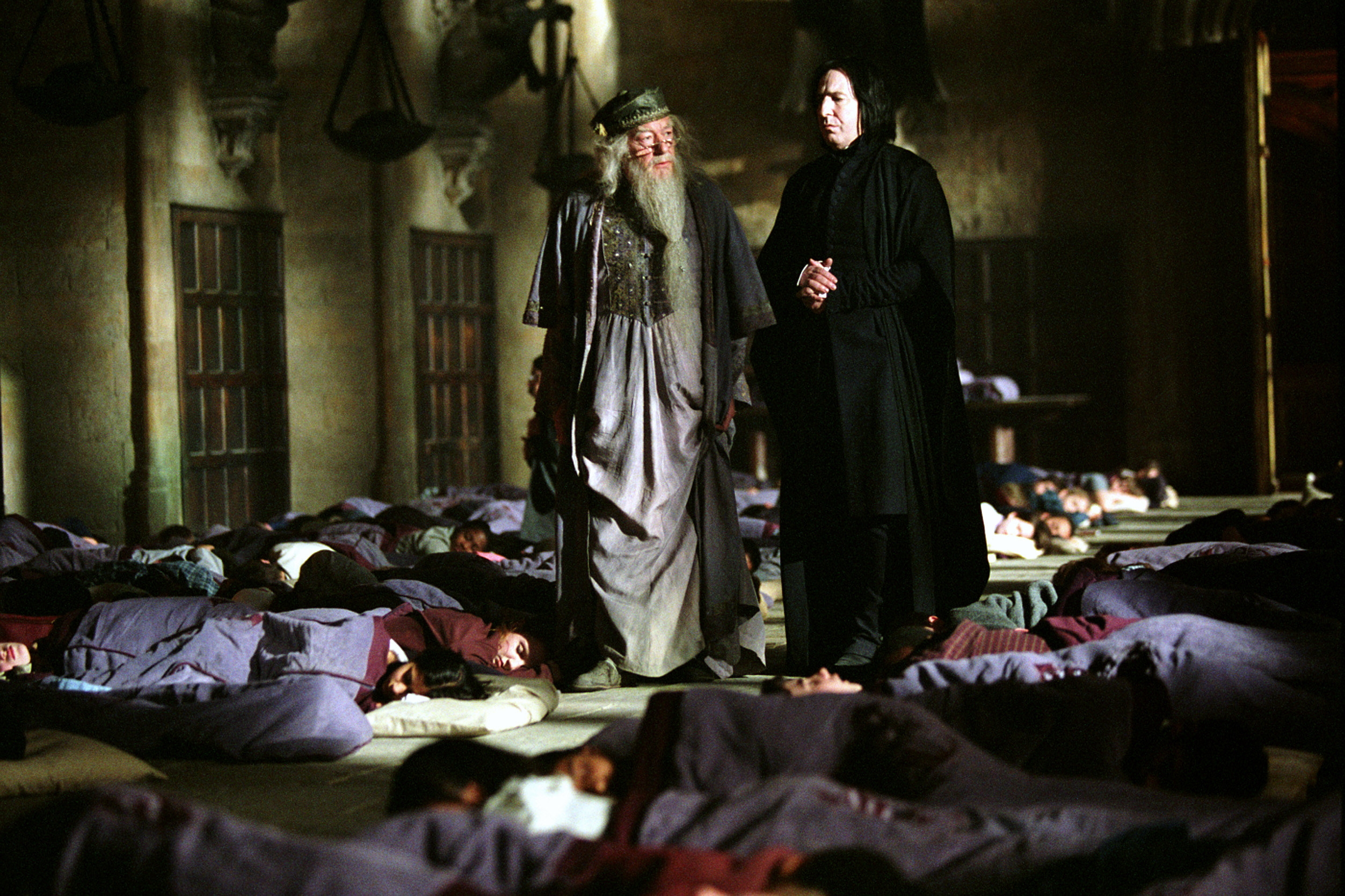 Michael Gambon and Alan Rickman presiding over a bunch of students in sleeping bags