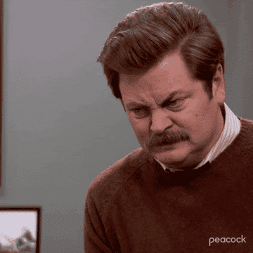 a gif of nick offerman in parks and recreation saying dammit