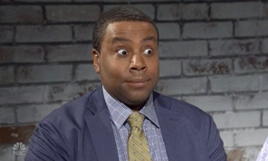 Kenan Thompson looking shocked with wide eyes