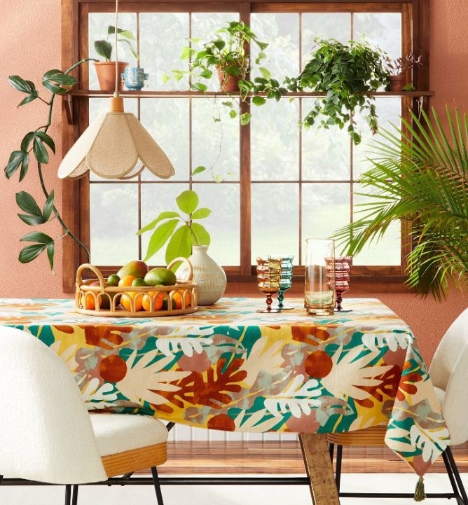 Multi-colored leaf-print tablecloth on a table