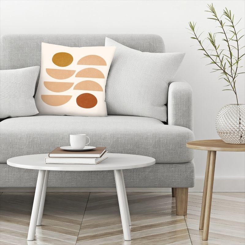 Decorative pillow on gray sofa in living room